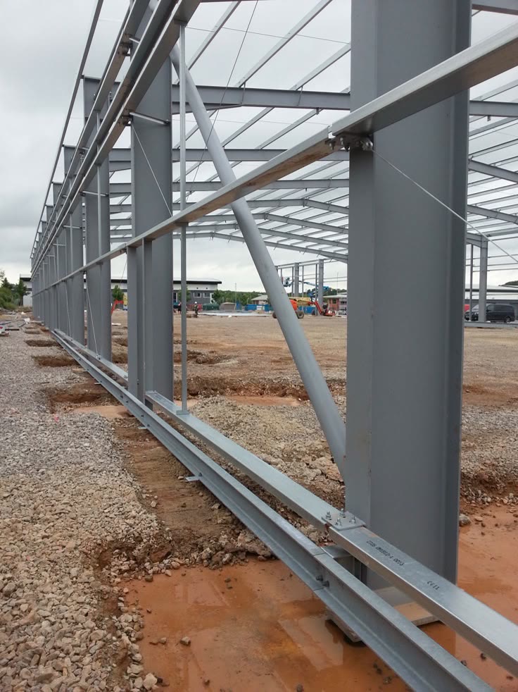 Steel portal frame structure erected for a warehouse, showing purlins and column bracing